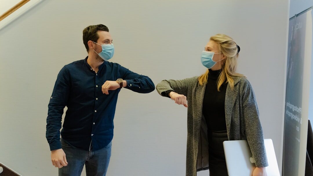 Two colleagues shaking hands in an office
