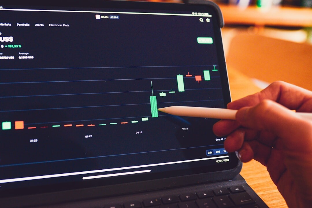 Person analyzing charts and graphs on a laptop screen