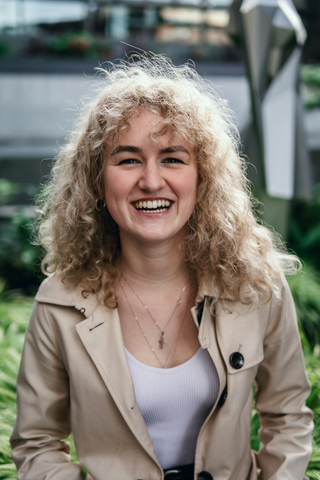 Portrait of a woman with curly hair smiling